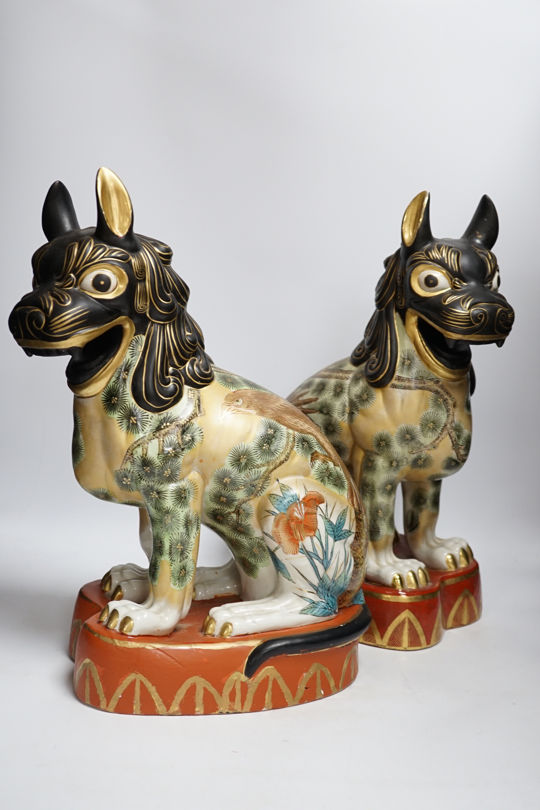 A pair of Chinese Macau porcelain lion dogs, 43cm